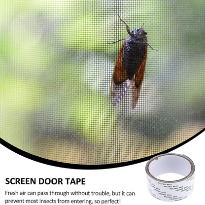 A large cicada resting on a black mesh screen, with a roll of repair tape in the bottom right corner.