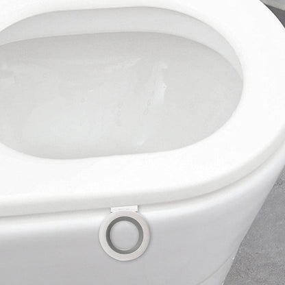 A close-up of a white toilet with the white and gray toilet seat lifter attached to the front of the seat.