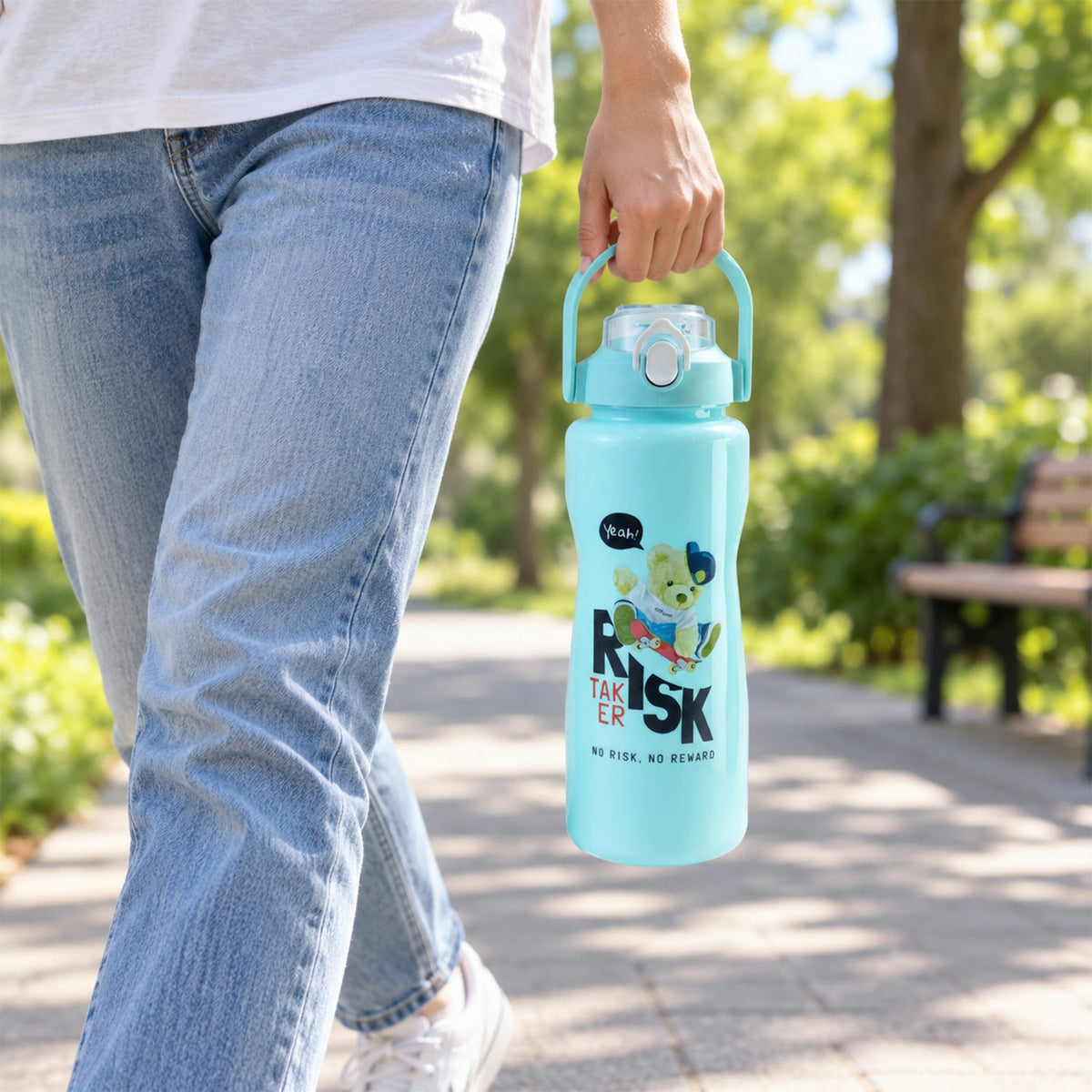A person walking outdoors, holding a large light blue water bottle with a handle.