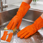 A person's hands wearing orange rubber gloves, washing dishes with a yellow sponge in a stainless steel sink.