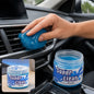 A hand presses blue cleaning gel into a car's air vent, with a jar of "Super Clean" gel in the foreground.