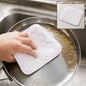 Hand scrubbing a dirty pan with a white honeycomb-patterned cleaning cloth, with an inset showing the cloth on a counter.