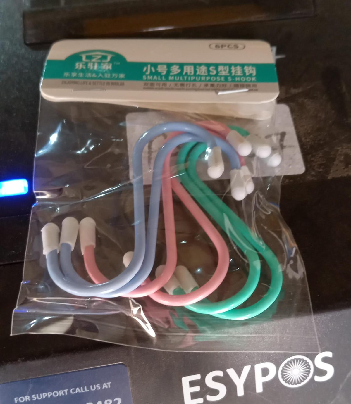 A clear plastic package containing six colorful plastic coated S hooks with a label in English and Chinese.