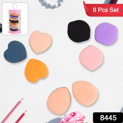 Eight mini makeup sponges in assorted colors and shapes, with a small image of them in a pink tube.