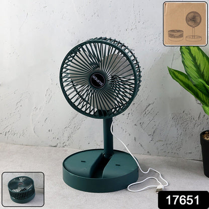 A dark green telescopic foldable mini USB desk fan with a white USB cable on a grey surface, with packaging details.