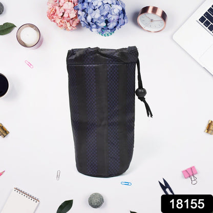 A navy blue drawstring pouch with vertical stripes stands upright on a white surface surrounded by office supplies and