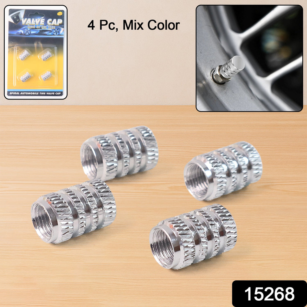 Four silver textured valve caps on a wooden surface, with packaging and an inset of a cap on a tire.