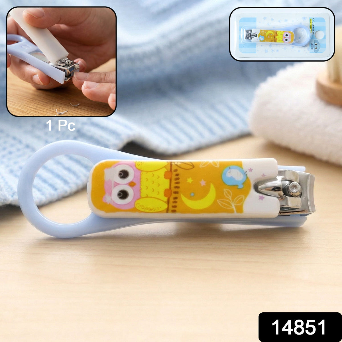 A baby nail clipper with an owl design, packaged in a clear plastic blister pack with a blue card backing.
