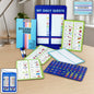 A blue magnetic daily quests board with various green and blue magnetic task cards and a sticker book on a wooden desk.